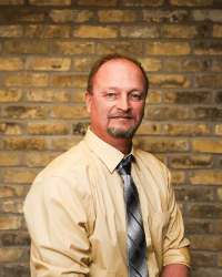 Brian Jung with brick background