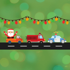 Santa riding in a truck, a fire truck, and police car on a road
