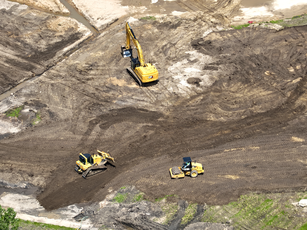 Close up of Excavation Work with construction equipment moving dirt